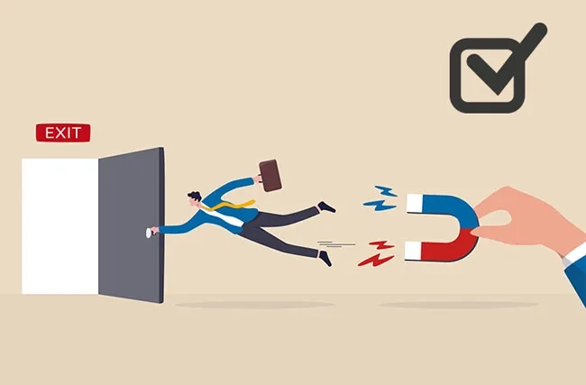 Ein Mitarbeiter wird mit von einem Magnet vom Gehen abgehalten